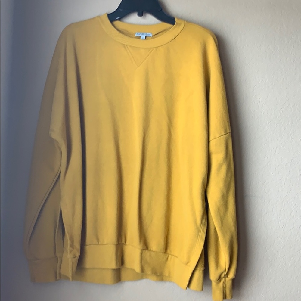 Charlotte Rues mustard yellow sweatshirt